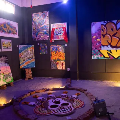 An installation view from my showcase at the MⒺTA-मोRPH-OSIS exhibition. It features a range of my canvas works and a custom floor piece, showing how my art can take over an entire space.