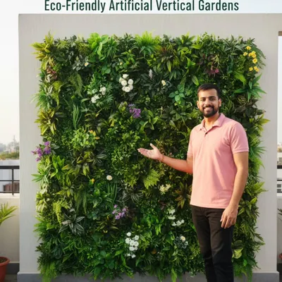 Here I am with a finished eco-friendly artificial vertical garden. These panels are dense with a mix of ferns, flowers, and leaves to create a rich, natural look on any wall.