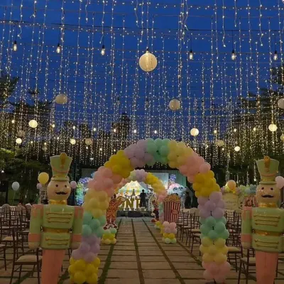 Vihaan's pastel carnival party at night was truly magical. The entrance arch and walkway were lit up with hundreds of fairy lights, creating a breathtaking welcome for all the guests.