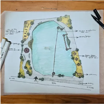 This hand-drawn master plan for a lakefront park shows a complete recreational ecosystem. It details the placement of a zip line across the water, a floating bridge, boating areas, and landscaped zones for picnics and relaxation.