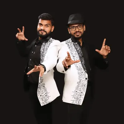 As a duo, our strength lies in our partnership. This professional studio photo captures our "Yin and Yang" dynamic, with matching jackets that symbolize our collaborative approach to creating magic. Together, we deliver a performance that is more than the sum of its parts.