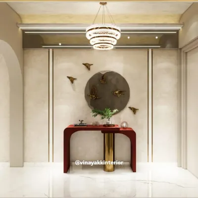 A beautifully styled entryway makes a powerful first impression. This design features a bold red console table, artistic bird-themed wall decor, and a modern crystal chandelier to create a sense of elegance and arrival.