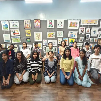 This is our wonderful group of students at the annual art exhibition. Displaying their work gives them a huge boost of confidence and a sense of accomplishment.