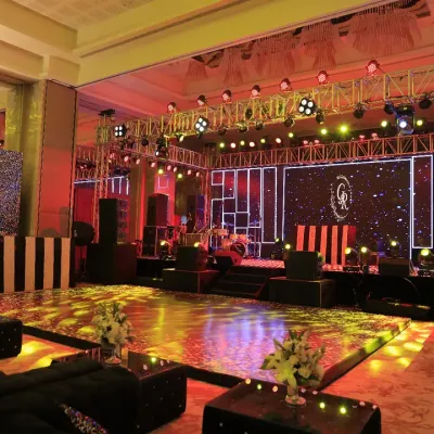 This Sangeet night was all about glamour. We designed a massive stage with a professional lighting rig, an LED backdrop for custom graphics, and a glossy dance floor, creating the perfect setup for a night of spectacular performances.