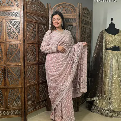 An elegant dusty pink saree with intricate silver embroidery. The full-sleeve blouse adds a modern touch to this classic pre-loved ensemble.