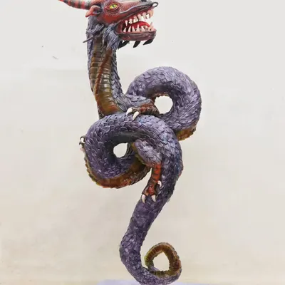 This is my award-winning Ouroboros cake, a sculpted dragon that won at Cakeology 2024. This gravity-defying structure is made almost entirely of cake and represents the eternal cycle of rebirth.