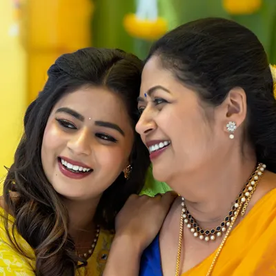 A beautiful, candid moment between actresses Inchara and Mansi Joshi during a Haldi-themed shoot. I created fresh, glowing makeup for both.