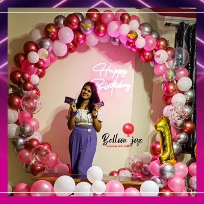 It brings me so much joy to see clients enjoying the backdrops we build. This full circular arch in pink, red, and silver, complete with a neon sign, created the perfect photo-op for this birthday celebration.