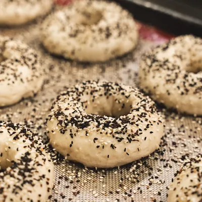 Our freshly baked everything bagels, ready to be bagged up and sold at our deli counter.
