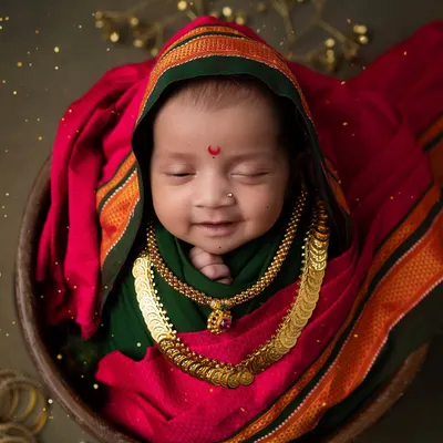 A divine smile for Ganesh Chaturthi. This little one, dressed in a traditional Maharashtrian style, is a perfect picture of festive joy and innocence.