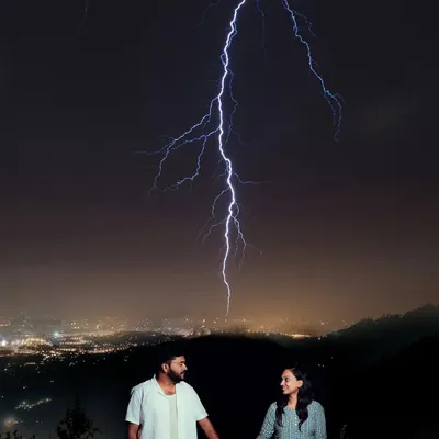A truly electric moment. We captured this incredible pre-wedding shot with a real lightning strike, showing our dedication to creating one-of-a-kind images.
