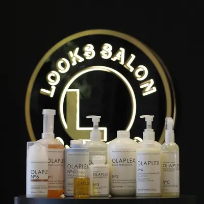 The full professional Olaplex lineup at our salon. From the in-salon No.1 and No.2 steps to the take-home maintenance products, we have everything needed to rebuild and protect your hair.