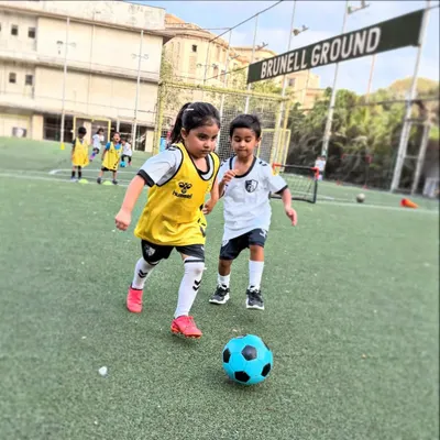 Dribbling with determination at our Brunell Ground facility. We provide our youngest players with the right gear and guidance to start their football journey confidently.