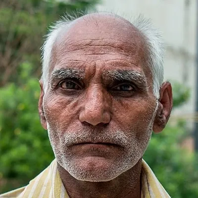 I met this gentleman on the street and was drawn to his intense, thoughtful expression. His face shows a life of experience, and I wanted to capture that character in a direct, honest portrait.