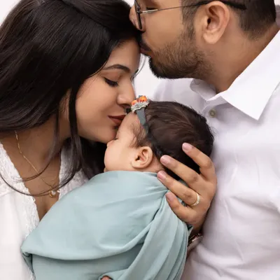 The first days as a family are so precious. We focus on capturing the deep connection between parents and their newborn in intimate, close up shots like this.
