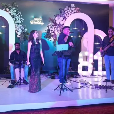 A full view of our live band performing at an 81st birthday party. The setup includes our talented male and female singers, a keyboardist, and a guitarist, creating a rich sound perfect for milestone celebrations.