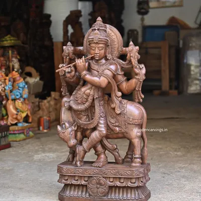A stunning 36-inch sculpture of Venugopal, the flute-playing Krishna, standing with his sacred cow. The wax brown finish gives this large statue a timeless and classic appeal, perfect for a main altar.