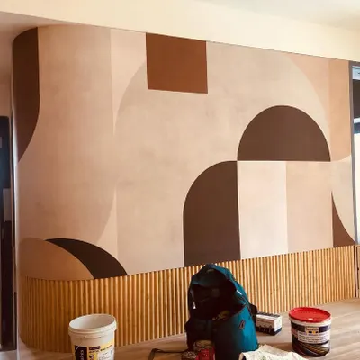 This large-scale abstract mural features bold geometric shapes in earthy tones. I installed it on a curved wall with wainscoting, requiring precise cuts for a perfect fit.