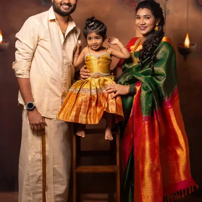 The complete family portrait. This photo captures the family of three, soon to be four, in their beautiful traditional attire. It’s a perfect memory of this special time of transition and growth for the whole family.