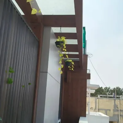 To make the most of a small balcony, I use vertical space. These hanging baskets add a beautiful trailing element of green without taking up any floor space, drawing the eye upward.