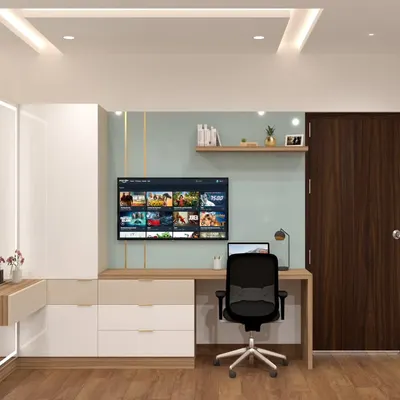 This custom-built unit seamlessly combines a study desk, a TV entertainment area, and a dressing table with storage. The light wood and white finish keeps the design feeling bright and uncluttered.