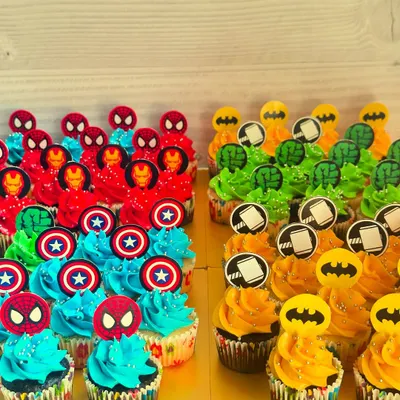 This large set of superhero mini cupcakes shows the variety I can offer for a big party, featuring characters from both Marvel and DC. Each cupcake, whether vanilla with Nutella or chocolate with ganache, gets its own unique, colorful design.