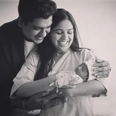 The pure joy on these new parents' faces says it all. This black and white hospital photo captures a candid, emotional moment just after their baby's arrival. These Fresh 48 sessions are all about documenting the real feelings of this special time.