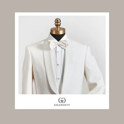 A close-up of the shawl collar and bow tie on our bespoke white tuxedo. We use premium fabrics and traditional tailoring techniques to create timeless formal wear for men.