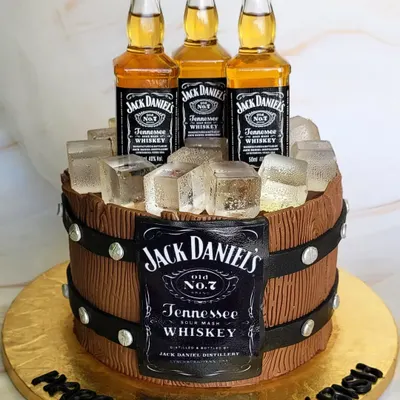 What more do you need? A Jack Daniel's barrel cake, complete with miniature whiskey bottles and edible ice cubes. This is the perfect cake for a whiskey lover.
