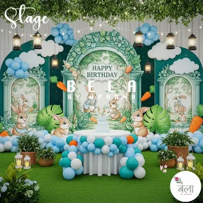 The main stage for the Rabbit Land theme, featuring a large backdrop with adorable rabbit illustrations and a central cake table. The faux grass floor, balloon clouds, and hanging lanterns create a complete, storybook atmosphere.