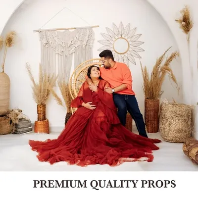 A beautiful maternity portrait celebrating the journey to motherhood. I use premium quality props and elegant gowns, like this flowing red dress, to create stunning and artistic images for expecting parents.