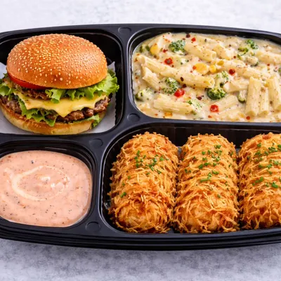 A burger, white sauce pasta, fried snacks and dip show the continental choices in our party snack menu.
