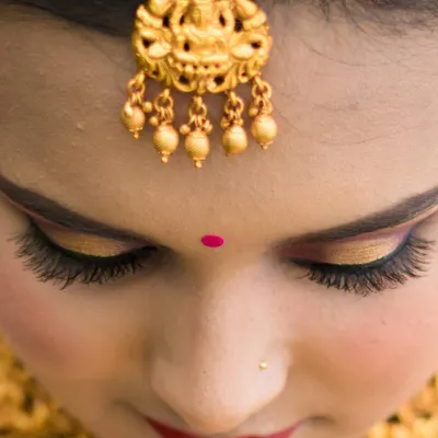 This close-up showcases a classic bridal eye makeup look. I used a golden shimmer on the lid, defined the crease, and added full lashes for a dramatic yet elegant effect.