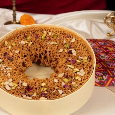My signature Paneer Ghewar, a masterpiece of texture and flavour. This iconic Rajasthani dessert is perfect for festivals like Teej and Raksha Bandhan, or any grand celebration.