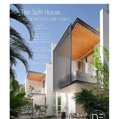 The exterior of the Split House, where the design is defined by a linear 'split' in the roof that houses a skylight. This feature was conceived to preserve a large existing tree on the site and bring natural light deep into the home. The facade combines clean white walls with warm wood ceilings and granite louvers for privacy.
