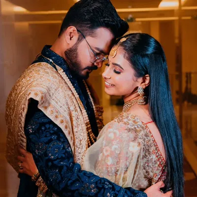 An intimate embrace, capturing the deep connection and romance between the couple. The soft lighting and their close posture create a timeless and emotional portrait.