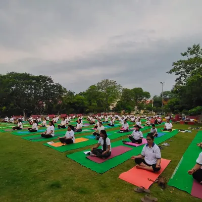 A wide shot of our community practicing meditation together outdoors. This was taken during our International Yoga Day celebration, reflecting our vision of creating one family of love and happiness.