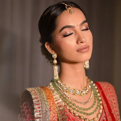 A close-up showcasing the detailed eyeshadow work for a bridal look. I used a palette of warm, shimmery tones and a subtle winged liner to create a romantic and elegant effect.