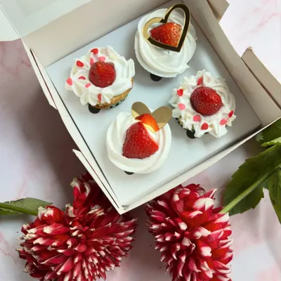 Spreading the love with these Valentine's Day special cupcakes. Topped with fresh strawberries and cream, they are the perfect sweet treat for your special someone.