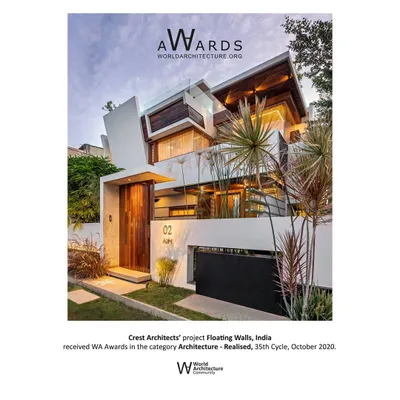 Our project 'Floating Walls' was honored with a World Architecture Community Award. The design is a play of slits and masses, creating a dynamic tropical modern home that engages with its surroundings.