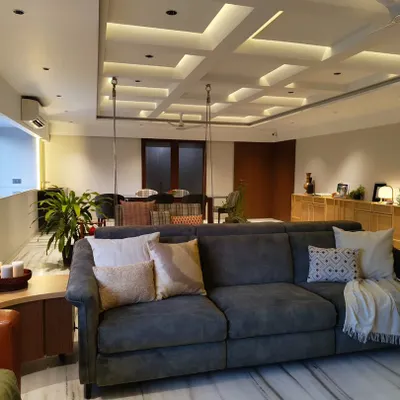 I call this the "hygge" corner. With its plush sofa, warm lighting, and cozy throws, it’s the perfect spot to curl up with a cup of hot chocolate on a rainy day.