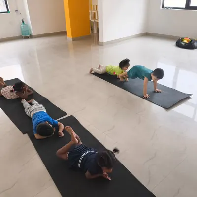 Building core strength and flexibility! Our indoor classes include gymnastics and fitness elements, like this plank exercise, to develop well-rounded athletes.