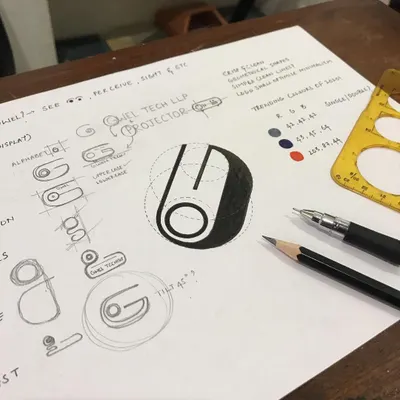 A look at my workbench during the logo development for Gwel Tech. You can see the progression from initial sketches and lettering ideas to a geometrically refined mark, complete with color palette considerations and notes.