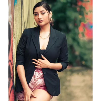 The lead shot for a 'BOSS LADY' social media campaign. This image establishes a strong, confident persona for the brand, blending power dressing with an edgy, urban environment.