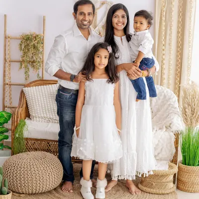 A beautiful family portrait in our natural light studio setup. We guide families into comfortable poses that feel genuine and show their connection.