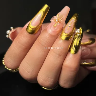 A side view of the stunning 3D gold chrome and flower nail art. You can really see the dimension of the clear floral charms and the liquid gold effect of the chrome.