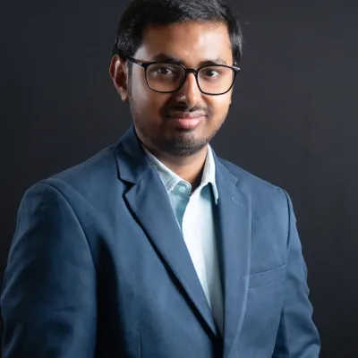 This is a great example of our classic studio work. The controlled lighting and professional dark background ensure you look sharp and credible, making it an ideal choice for a corporate headshot or resume photo.