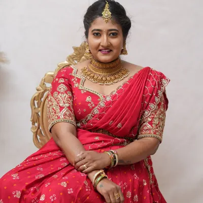 A happy client looking beautiful for her event. She rented this stunning antique gold choker set from our store in RR Nagar.