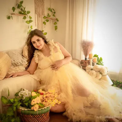 Bathed in soft, warm light, this portrait captures the dreamy and elegant feel of my bohemian studio setup. The yellow tulle gown adds a touch of sunshine to the earthy, natural decor.