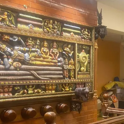 A customer-shared image of our Sri Ranganathar panel installed as a magnificent centerpiece. The integrated lighting highlights the depth and vibrant colors of the carving, creating a sacred focal point in their home.